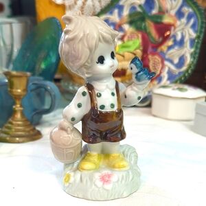 Charming Ceramic Figurine with Bluebird